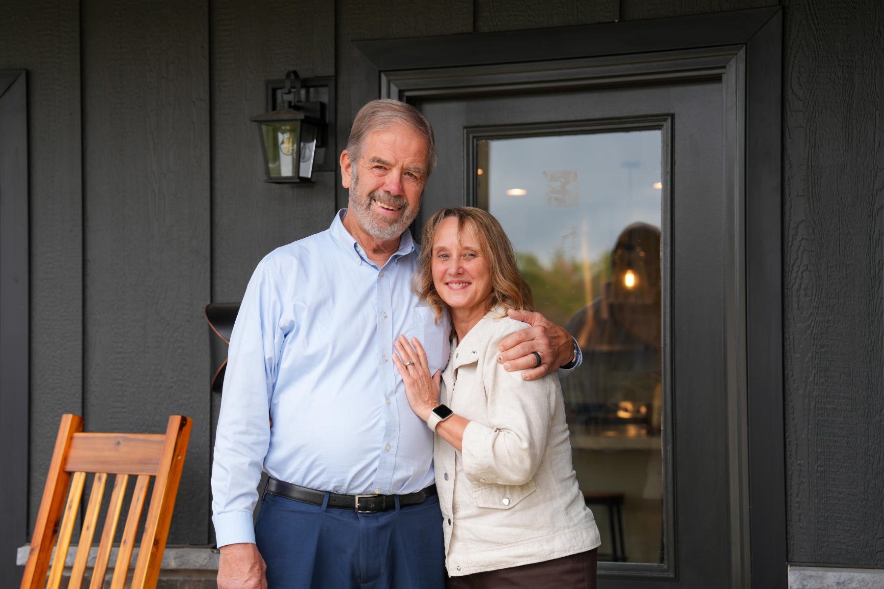 Residents on the porch of their new home